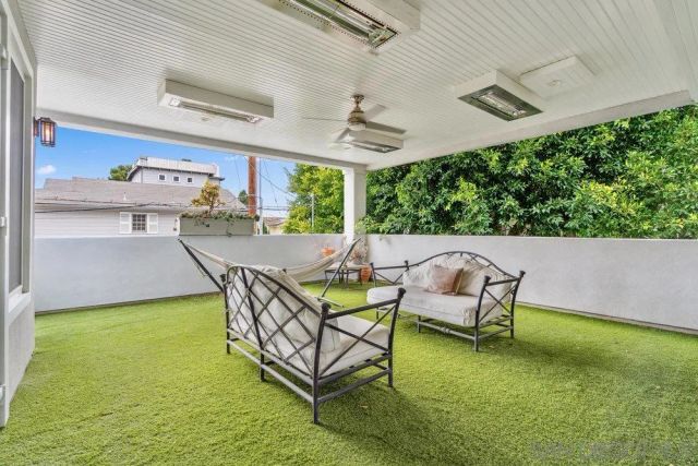 a swimming pool with outdoor seating and yard