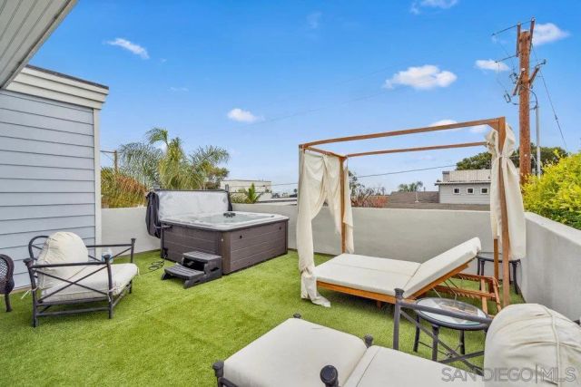 a view of a patio with chairs and a table