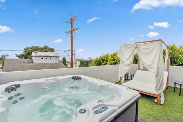 a bathroom with a tub and a sink