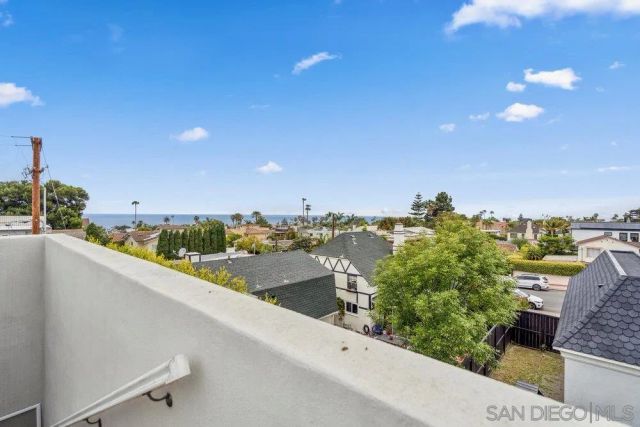 a view of a balcony with an outdoor seating