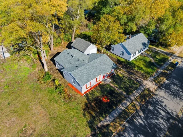 an aerial view of residential house with an outdoor space