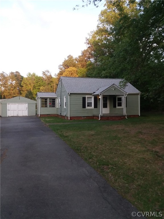 7001 Strath Road Richmond, VA 23231 - Photo 1 of 17 a front view of a house with a yard and trees