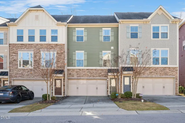 a front view of a house with yard