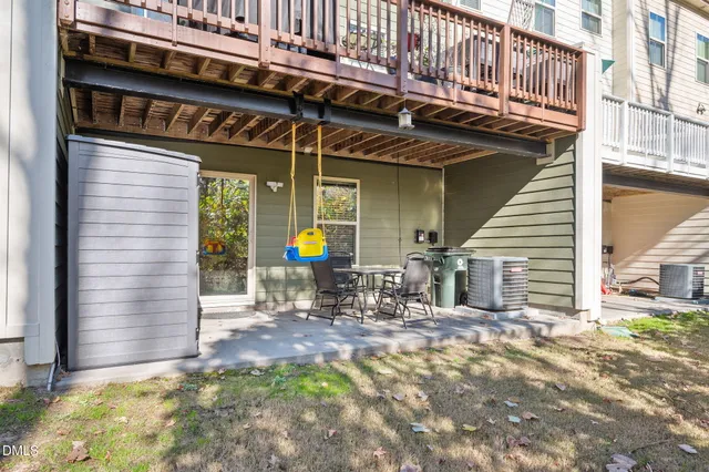 a view of a house with large window and sitting area