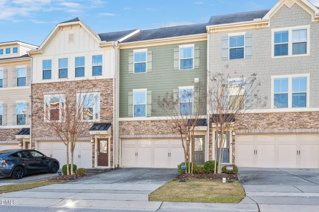 a front view of a building with garage