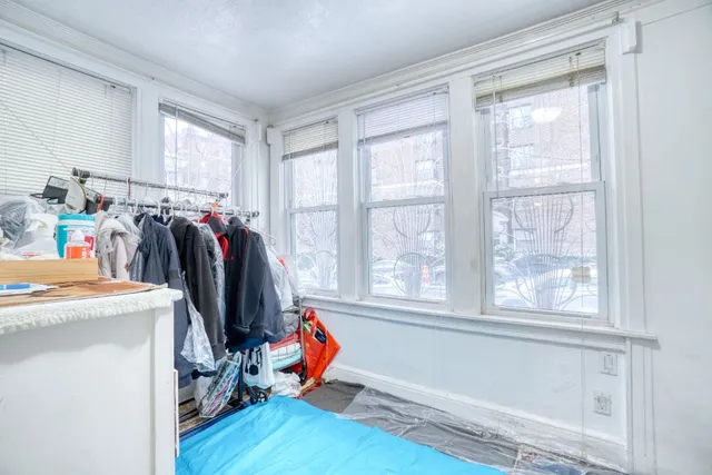 a view of a storage and utility room with windows