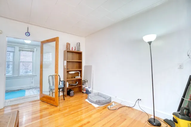 a room with furniture and a wooden floor