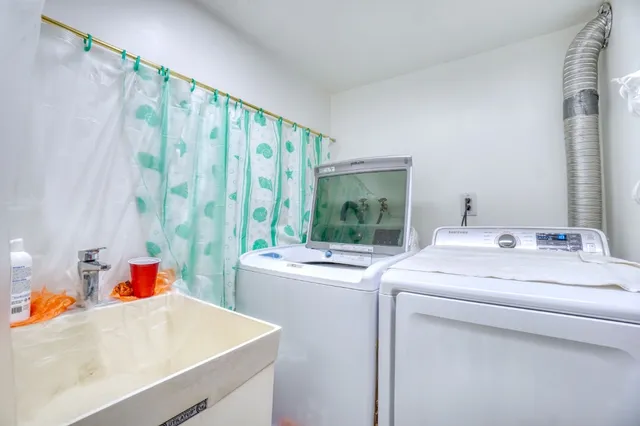 a utility room with dryer and washer