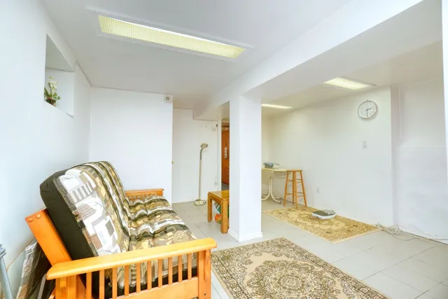 a living room with furniture and a rug