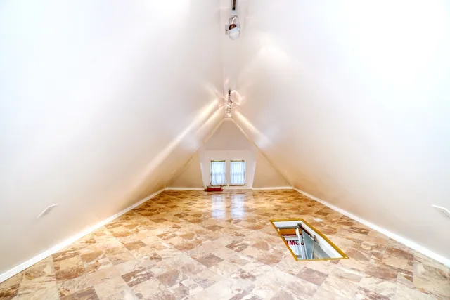 a view of a big room with closet and wooden floor