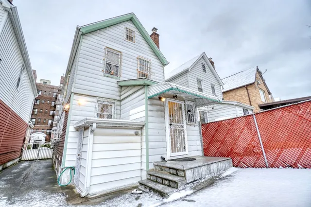 a view of a house with a balcony and stairs