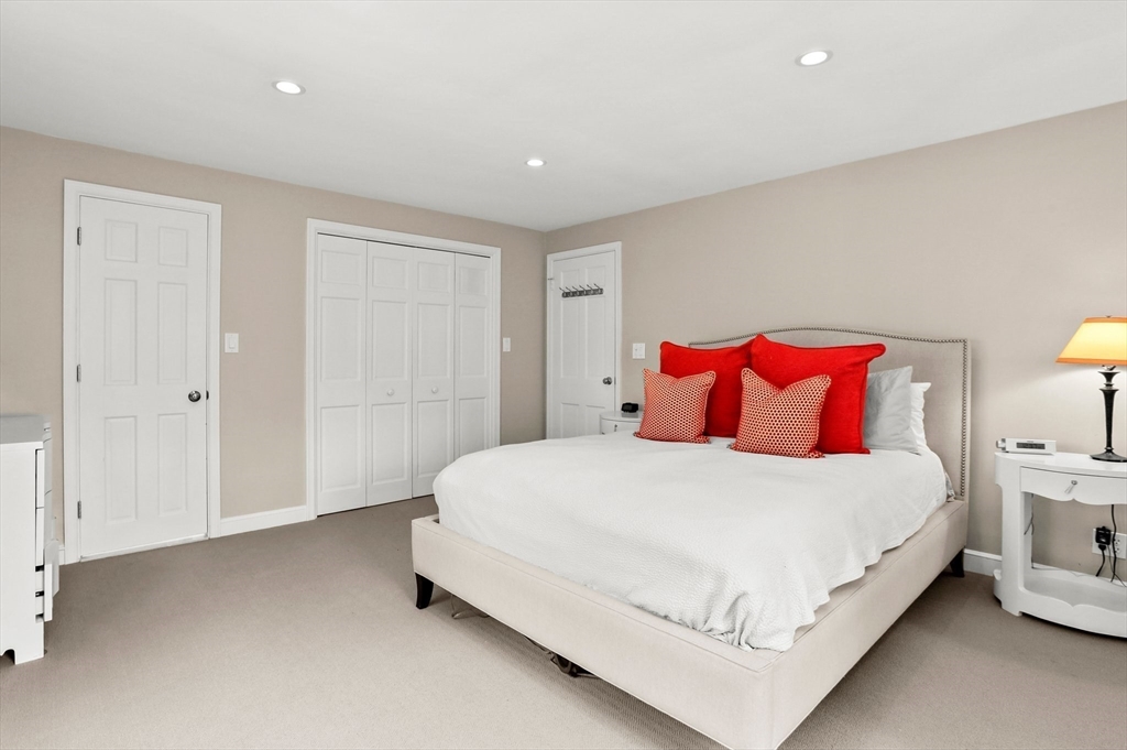 109 Suffolk Road Wellesley, MA 02481 - Photo 11 of 24 a bedroom with a bed and a night stand