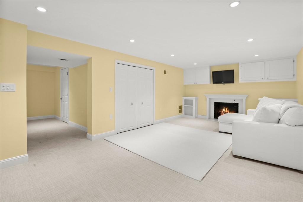 109 Suffolk Road Wellesley, MA 02481 - Photo 19 of 24 a living room with furniture and a fireplace