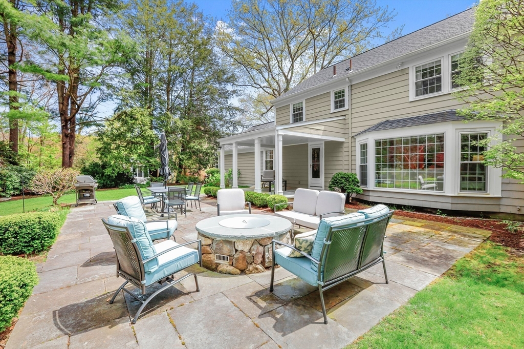 109 Suffolk Road Wellesley, MA 02481 - Photo 22 of 24 a view of a house with backyard sitting area and garden