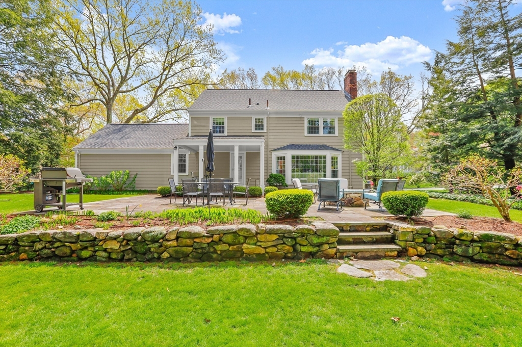 109 Suffolk Road Wellesley, MA 02481 - Photo 23 of 24 a front view of house with yard and outdoor seating