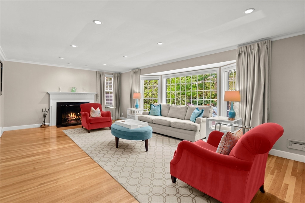 109 Suffolk Road Wellesley, MA 02481 - Photo 7 of 24 a living room with furniture fireplace and a large window
