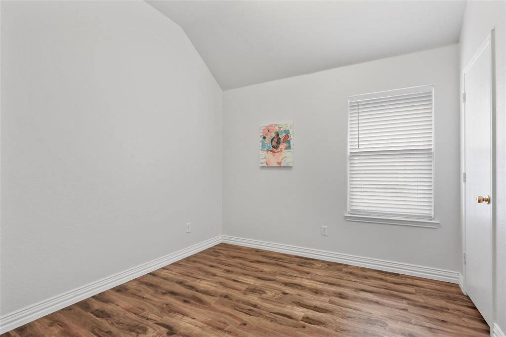 5961 Cheyenne Way Frisco, TX 75034 - Photo 25 of 33 Room featuring wood-finish flooring, white baseboards, and neutral wall paint