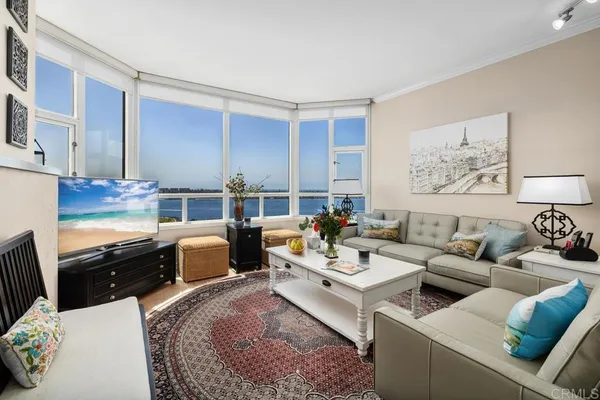 a living room with furniture fireplace and a window