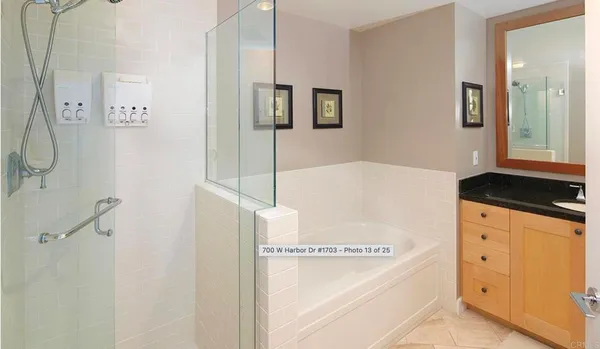 a bathroom with a bathtub sink and mirror
