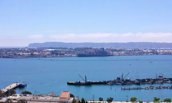 an aerial view of a house with a lake view