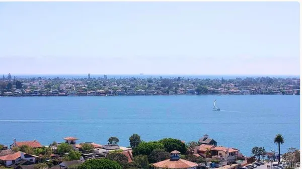 an aerial view of a houses with outdoor seating