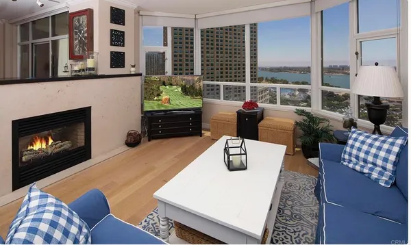 a living room with furniture fireplace and window
