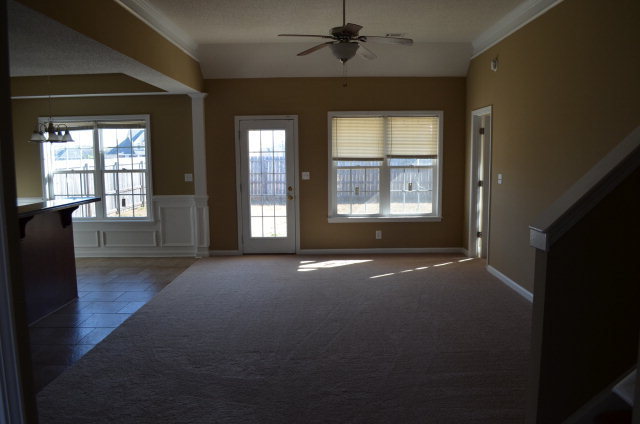 485 Bob White Road Macon, GA 31216 - Photo 7 of 13 a view of an empty room with a fireplace and a window