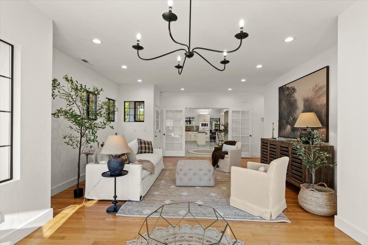 731 5th Street Gilroy, CA 95020 - Photo 14 of 31 a living room with fireplace furniture and a potted plant