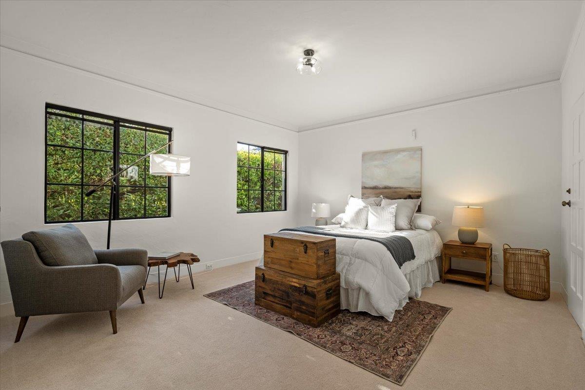 731 5th Street Gilroy, CA 95020 - Photo 21 of 31 a spacious bedroom with a bed and glass window