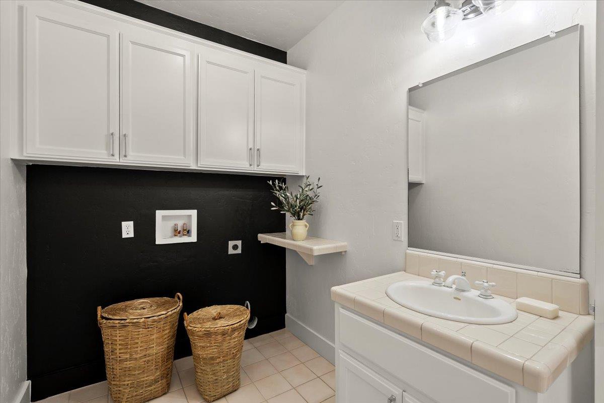 731 5th Street Gilroy, CA 95020 - Photo 23 of 31 a bathroom with a toilet sink and mirror