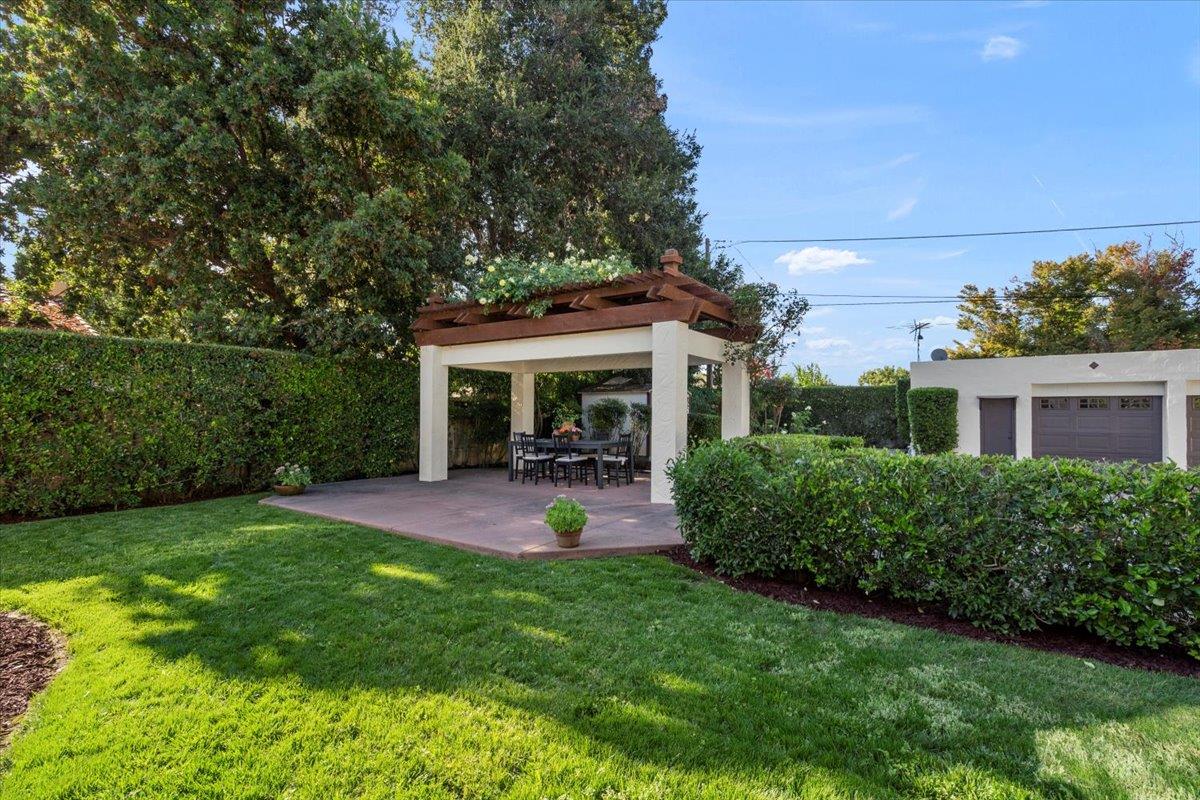 731 5th Street Gilroy, CA 95020 - Photo 28 of 31 a patio with table and chairs with plants and garden