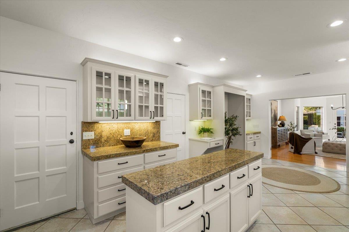731 5th Street Gilroy, CA 95020 - Photo 7 of 31 a kitchen with granite countertop a sink a stove and cabinets