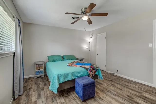 a bed room with furniture and a window
