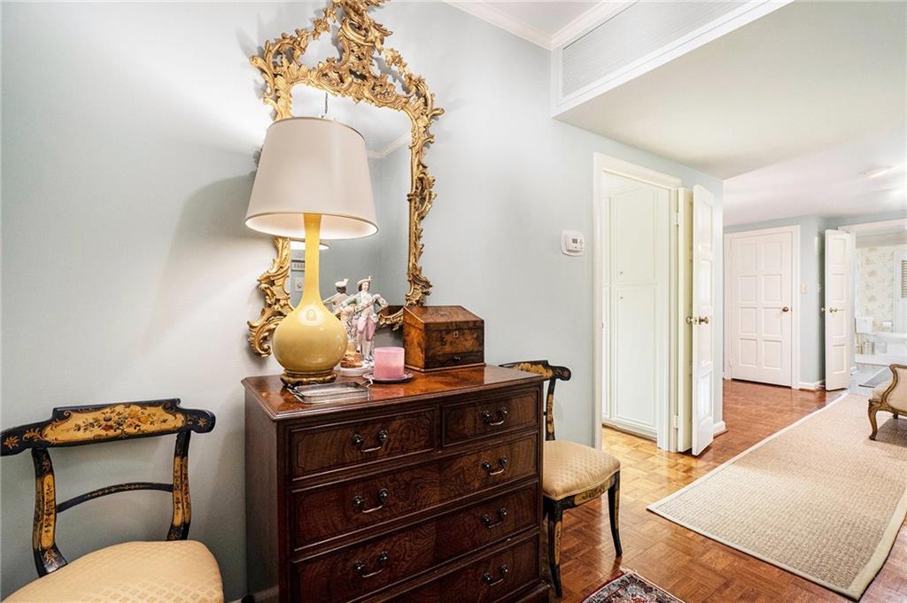 2769 Peachtree Road Northeast, Unit 6 Atlanta, GA 30305 - Photo 13 of 25 a bathroom with a toilet sink and mirror