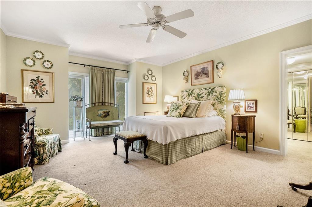 2769 Peachtree Road Northeast, Unit 6 Atlanta, GA 30305 - Photo 14 of 25 a bedroom with a bed and a chandelier