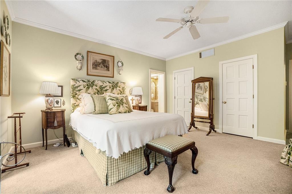 2769 Peachtree Road Northeast, Unit 6 Atlanta, GA 30305 - Photo 15 of 25 a bed room with a bed and a chandelier