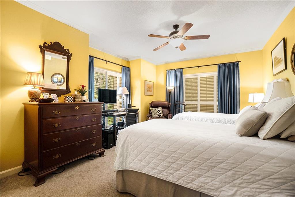 2769 Peachtree Road Northeast, Unit 6 Atlanta, GA 30305 - Photo 20 of 25 a bedroom with a bed and wooden floor