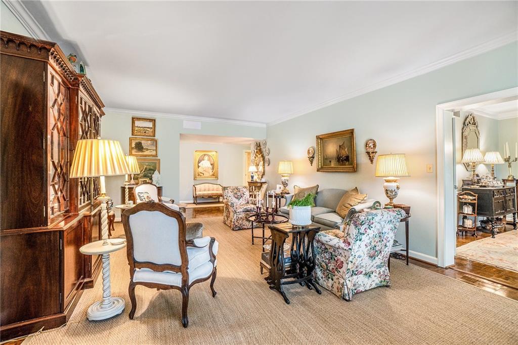 2769 Peachtree Road Northeast, Unit 6 Atlanta, GA 30305 - Photo 2 of 25 a living room with fireplace furniture and a large window