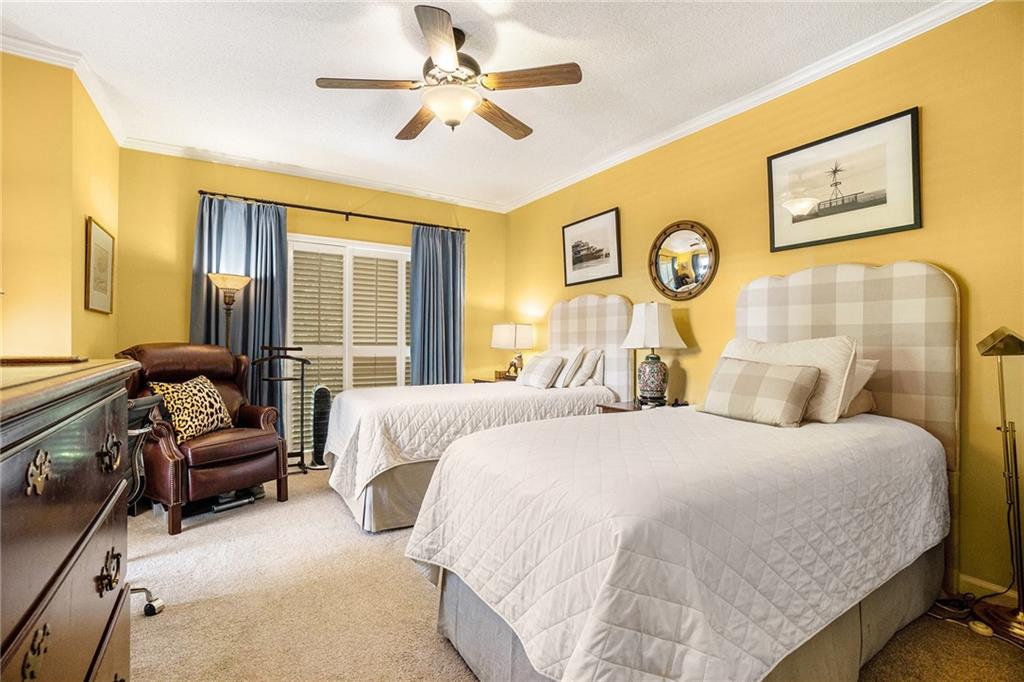 2769 Peachtree Road Northeast, Unit 6 Atlanta, GA 30305 - Photo 21 of 25 a bedroom with a bed couch and window