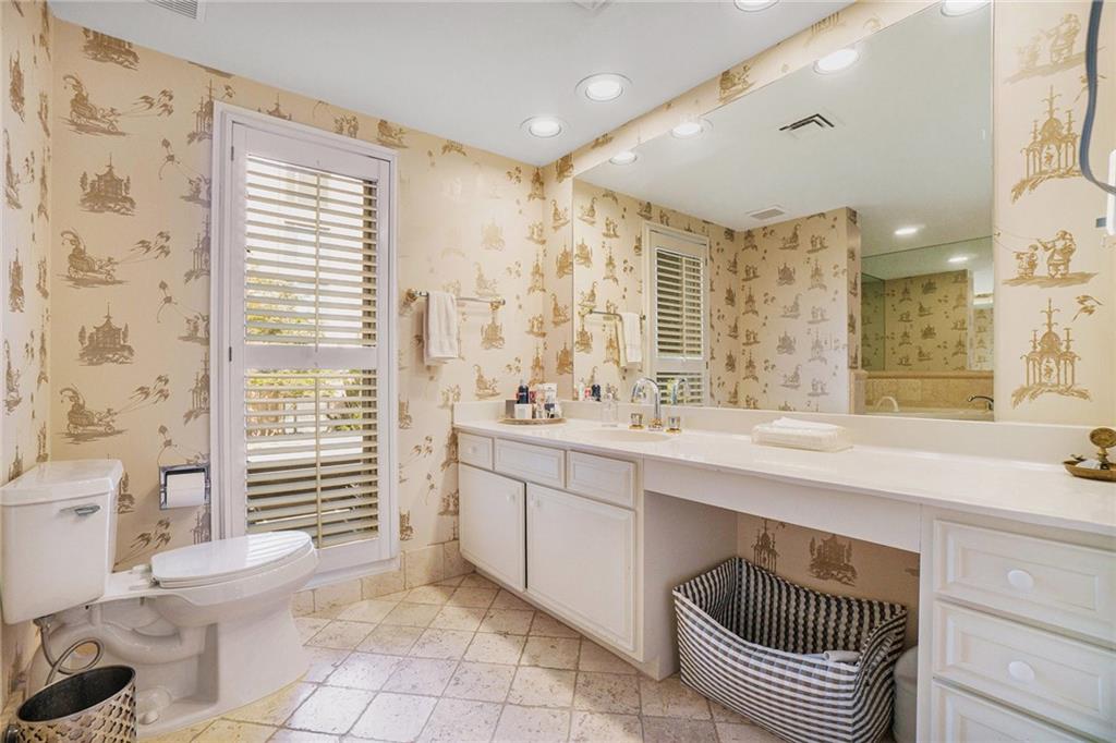 2769 Peachtree Road Northeast, Unit 6 Atlanta, GA 30305 - Photo 22 of 25 a bathroom with a sink a toilet and shower