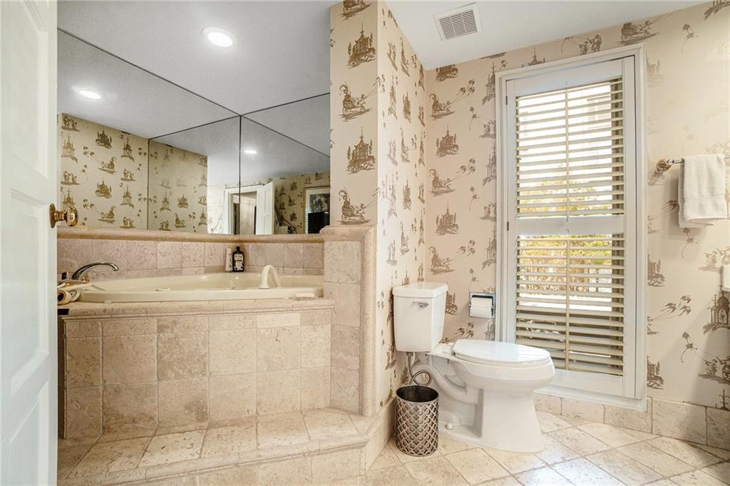 2769 Peachtree Road Northeast, Unit 6 Atlanta, GA 30305 - Photo 23 of 25 a bathroom with a sink toilet and shower