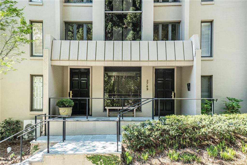 2769 Peachtree Road Northeast, Unit 6 Atlanta, GA 30305 - Photo 24 of 25 a front view of a house with porch
