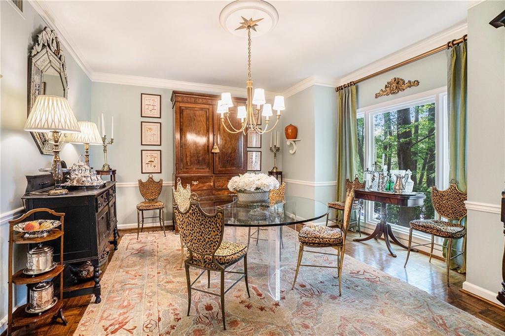 2769 Peachtree Road Northeast, Unit 6 Atlanta, GA 30305 - Photo 8 of 25 a view of a dining room with furniture and chandelier