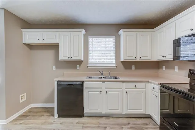 a view of an empty room and wooden floor