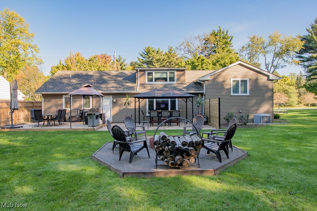 27230 Highland Road Cleveland, OH 44143 - Photo 12 of 41 The firepit, wood deck and gravel path around the side of the house were all added in 2023