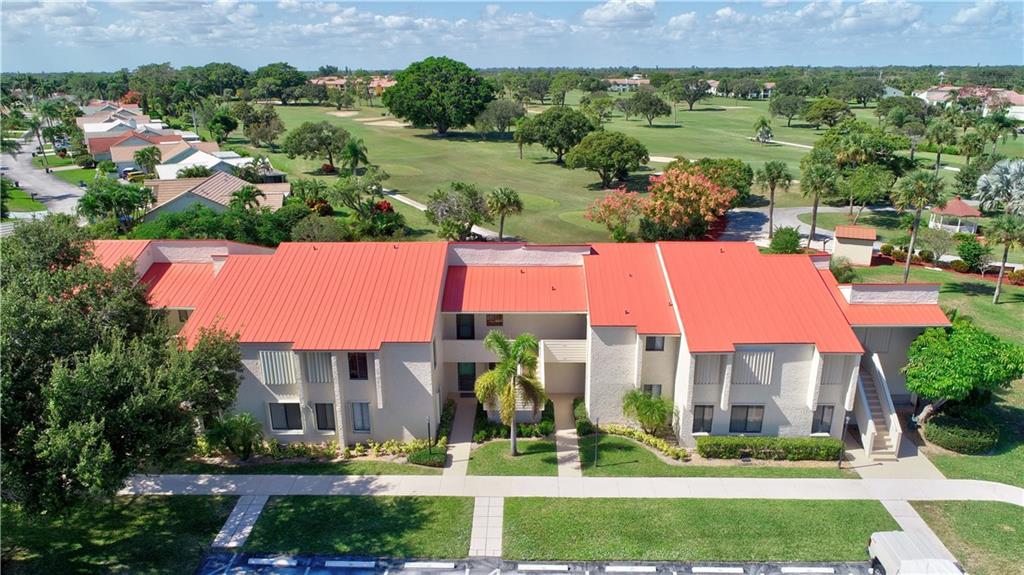 5111 Southeast Miles Grant Road, Unit 104 Stuart, FL 34997 - Photo 1 of 36 an aerial view of multiple house