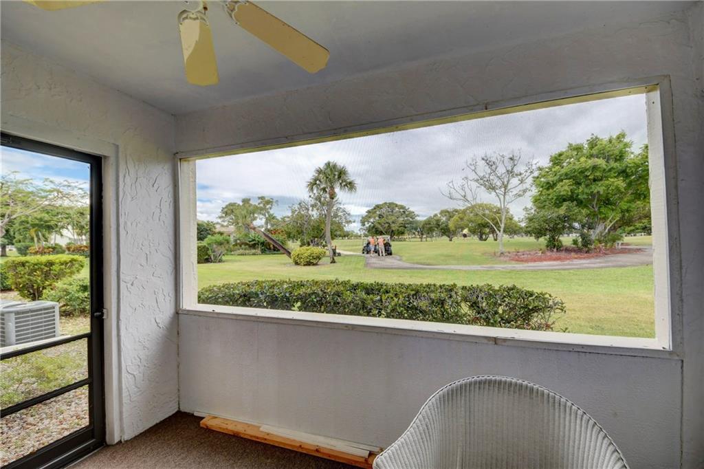 5111 Southeast Miles Grant Road, Unit 104 Stuart, FL 34997 - Photo 25 of 36 a view of balcony with furniture and garden