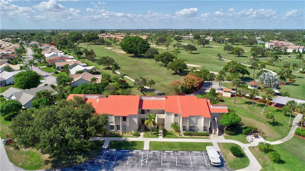 5111 Southeast Miles Grant Road, Unit 104 Stuart, FL 34997 - Photo 33 of 36 a view of a park with large trees