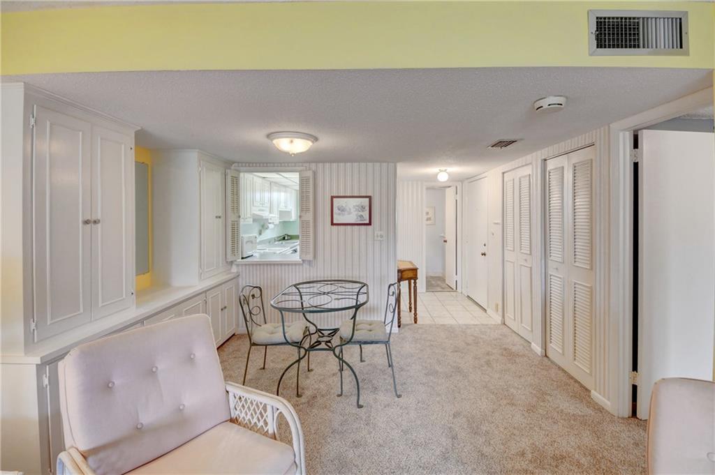 5111 Southeast Miles Grant Road, Unit 104 Stuart, FL 34997 - Photo 10 of 36 a view of a livingroom with furniture and window