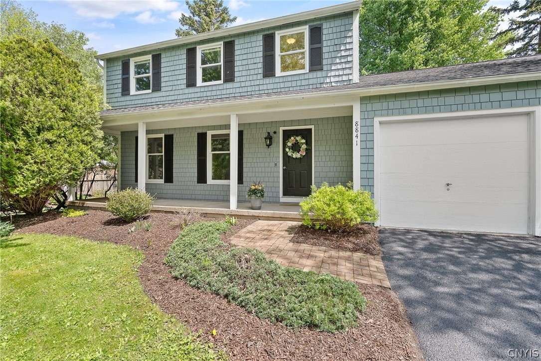 8841 Wandering Way Lysander, NY 13027 - Photo 2 of 42 Wonderful front porch just waiting for you to relax and enjoy this summer.